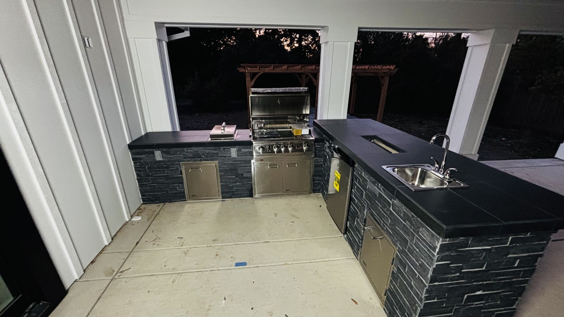 Custom covered outdoor kitchen built by Just BBQ Grills