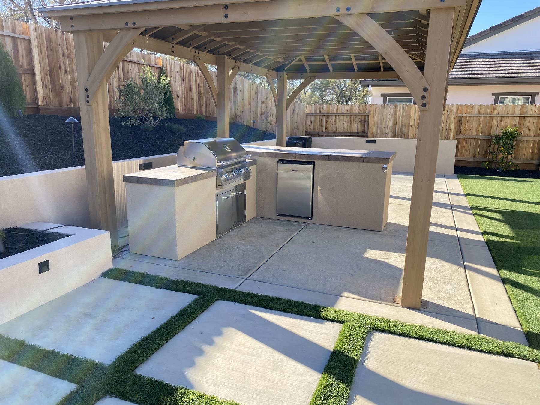 Covered outdoor kitchen built by Just BBQ Grills