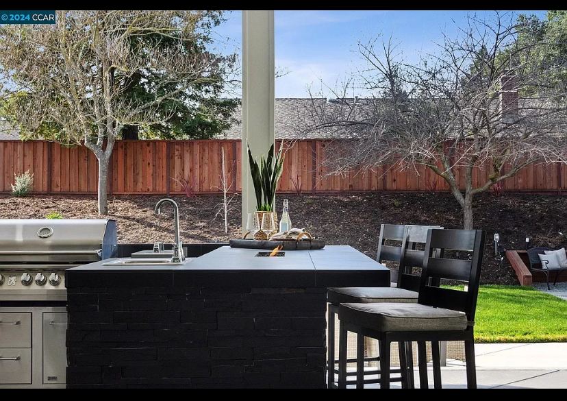 Custom covered outdoor kitchen built by Just BBQ Grills