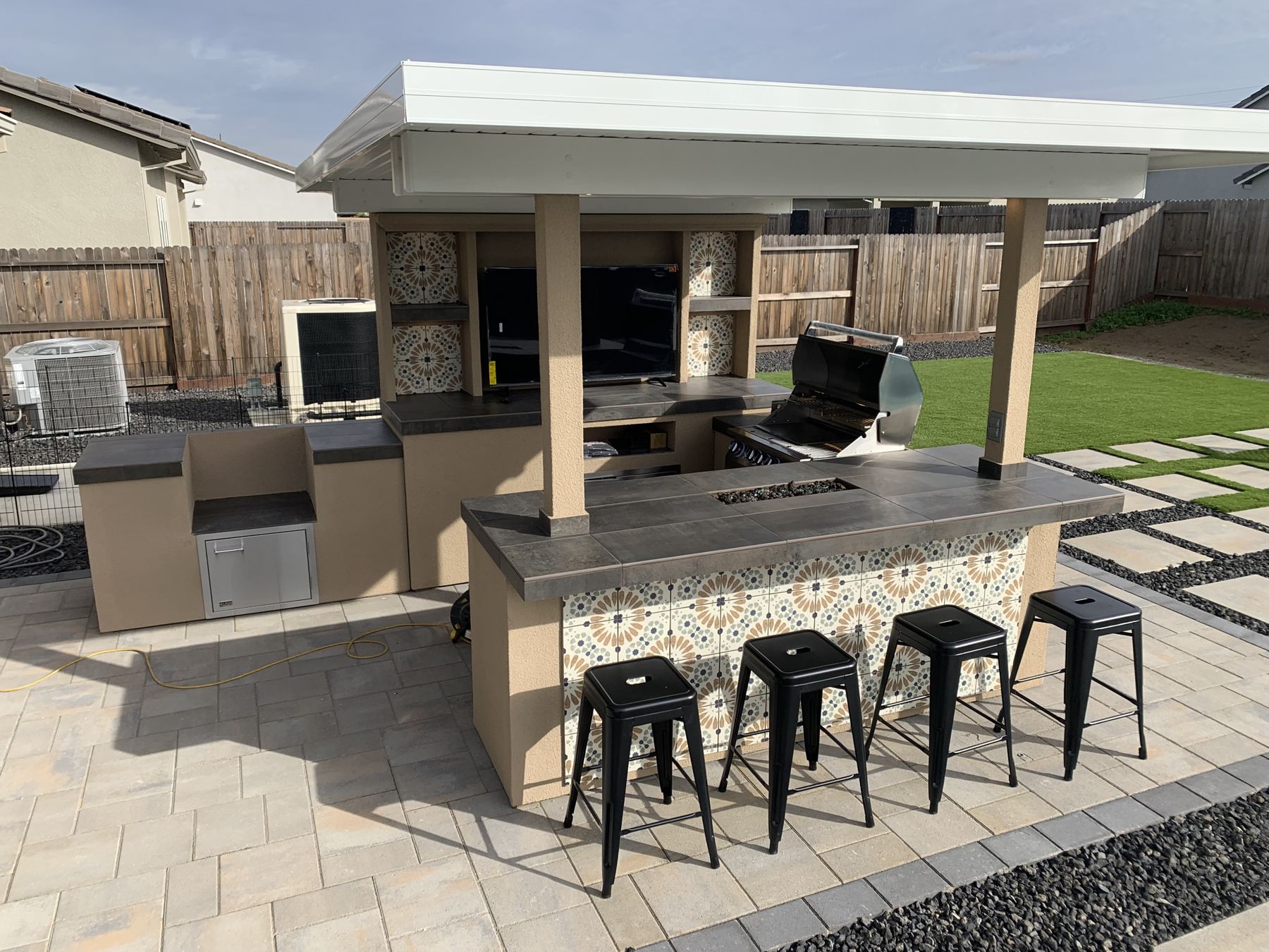 Covered outdoor kitchen built by Just BBQ Grills