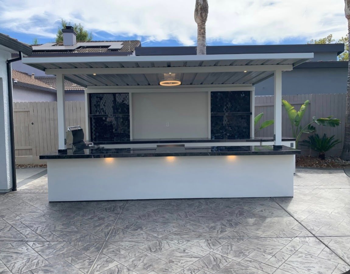 Front view of a black-tile entertainment cabana