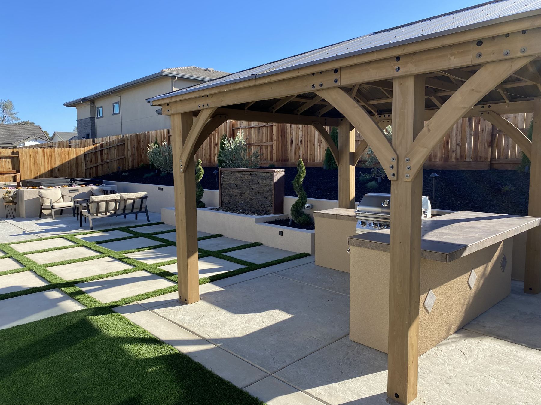 Covered outdoor kitchen built by Just BBQ Grills