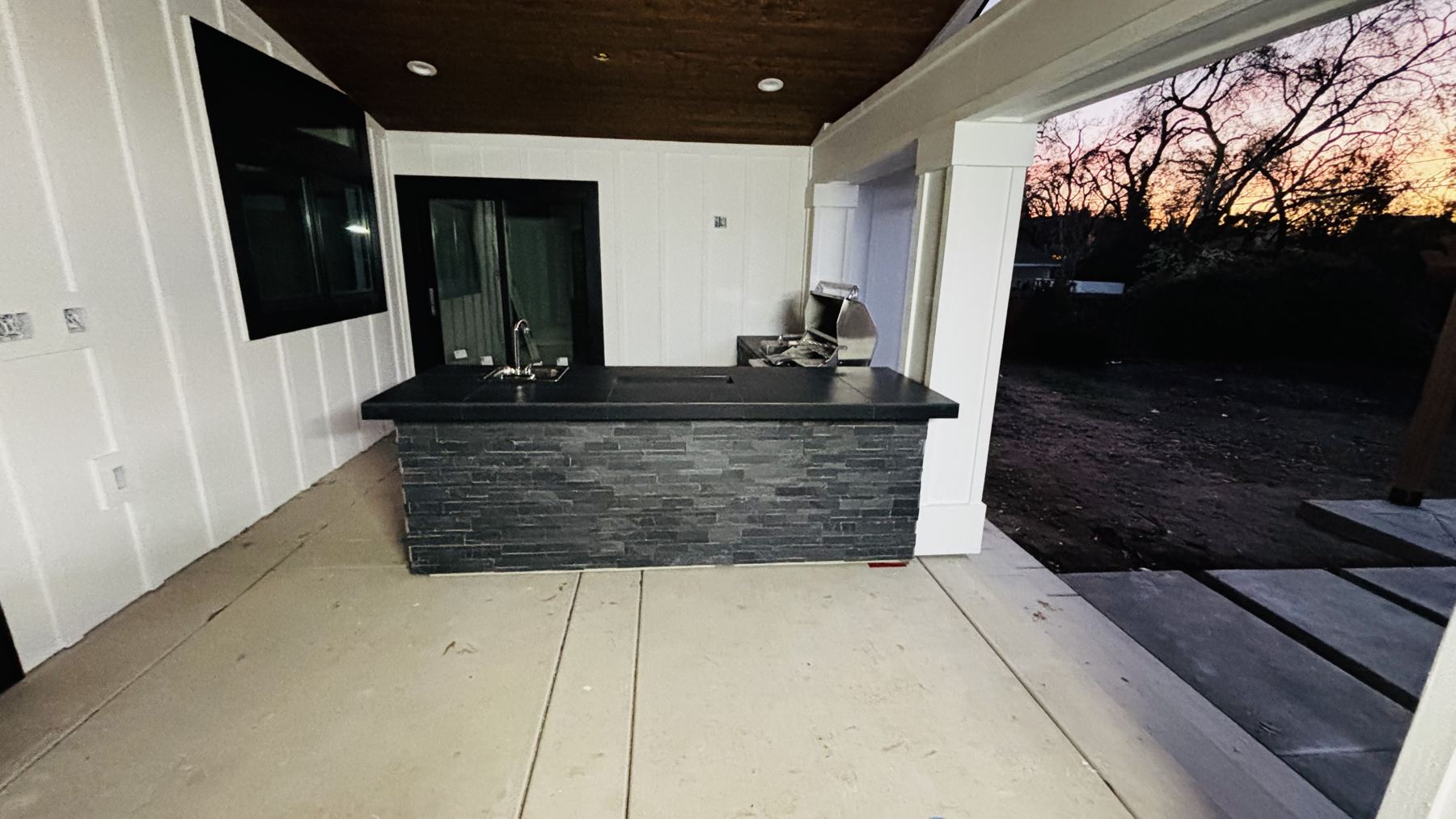 Custom covered outdoor kitchen built by Just BBQ Grills