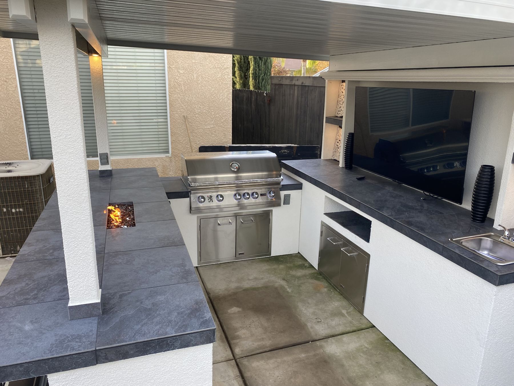Covered outdoor kitchen built by Just BBQ Grills