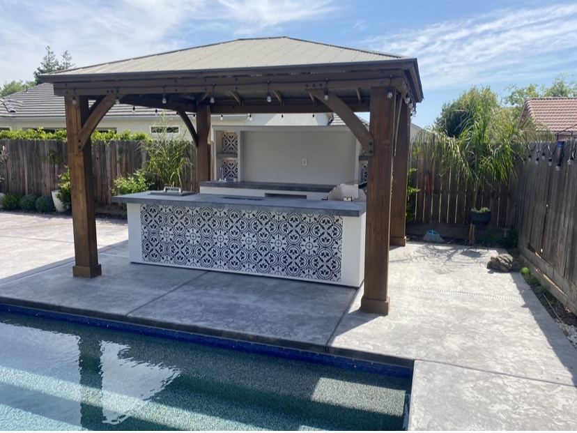 Covered outdoor kitchen built by Just BBQ Grills